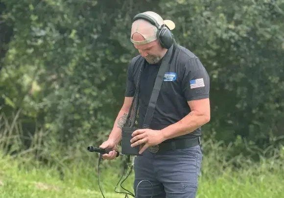 Justin, owner of Top Notch Plumbing, running acoustic leak-detection equipment in the field