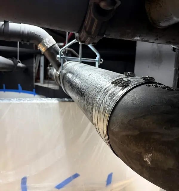 An insulated overhead pipe with a new repair coupling