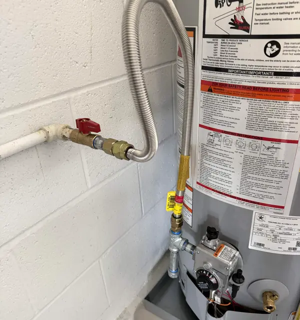 A gas water heater with a new shutoff valve and flexible gas line
