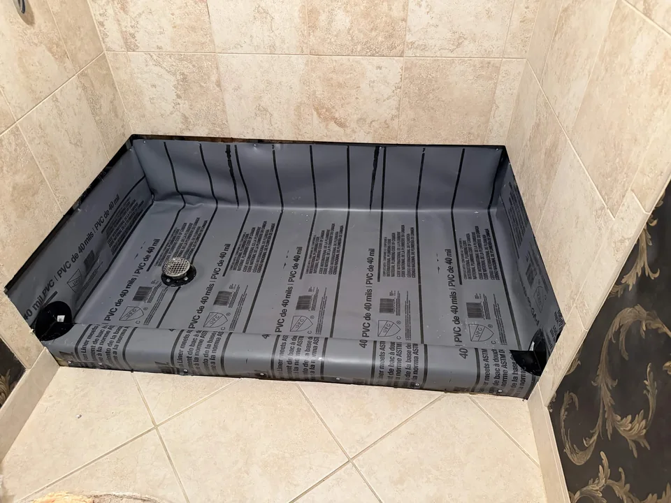 Shower base and drain during a bathroom renovation